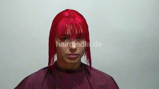 Oliya red perm roller set by Melody in dyeing apron