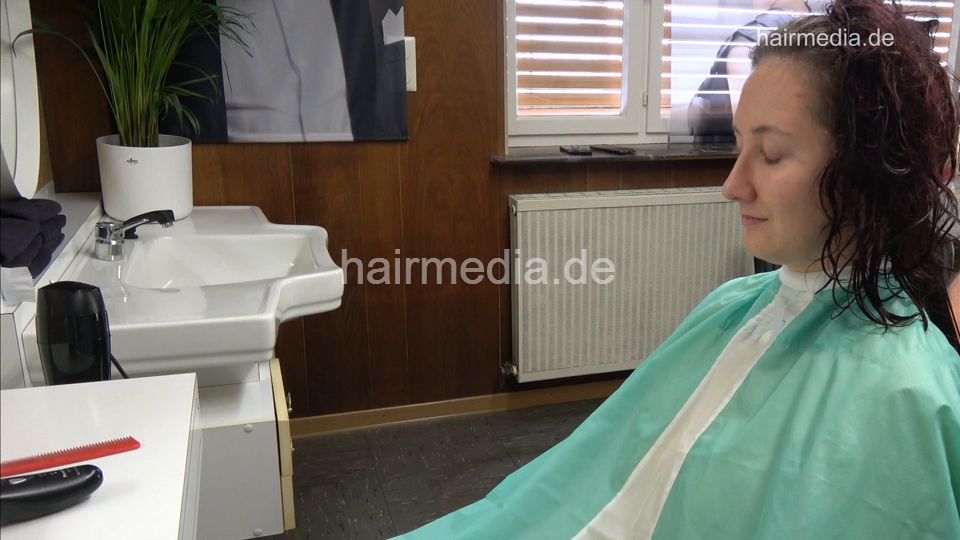 1238 Tetjana 4 wet haircut long and thick hair in green cape by barber and forward blow dry
