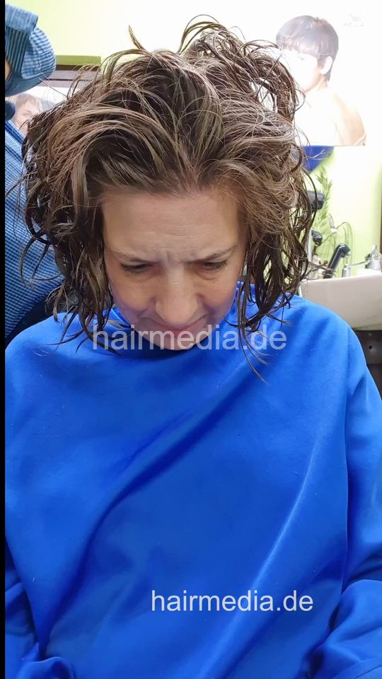 1243 XeniaM 3 wet haircut and blow forward by barber - vertical video