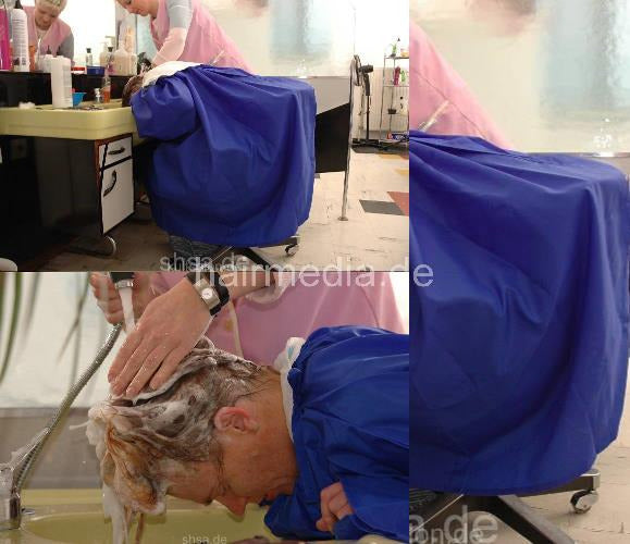 711 Michaela forward shampooing by Kultsalon barberette in large blue cape