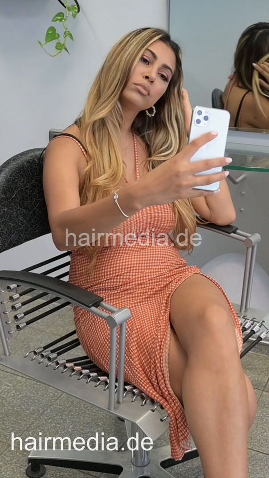 1209 3 Zoya waiting and typing in salon in summerdress vertical video