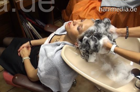 340 Sefora thick asian hair shampooing in salon by Lali in apron