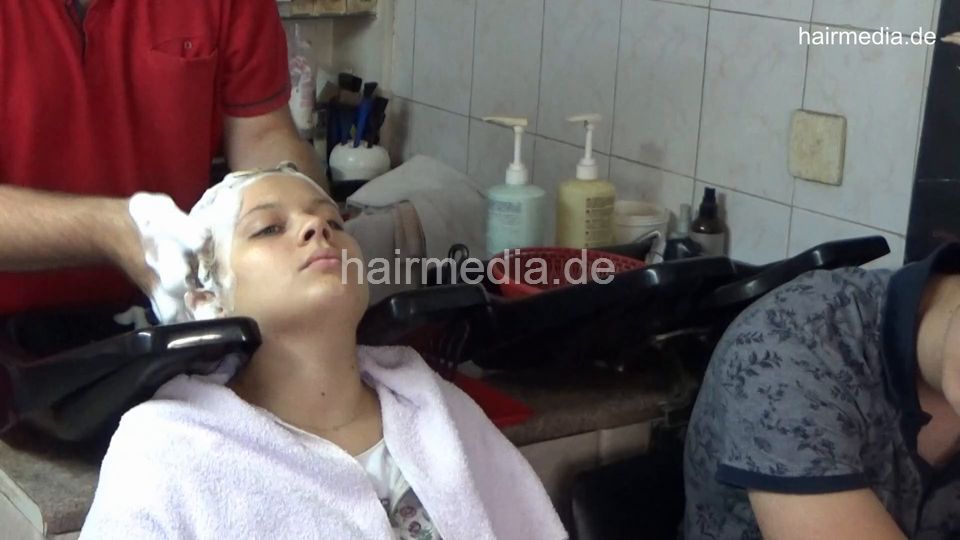 6212 TamaraL 1 teen backward hair face and ear wash by barber, boyfriend watching