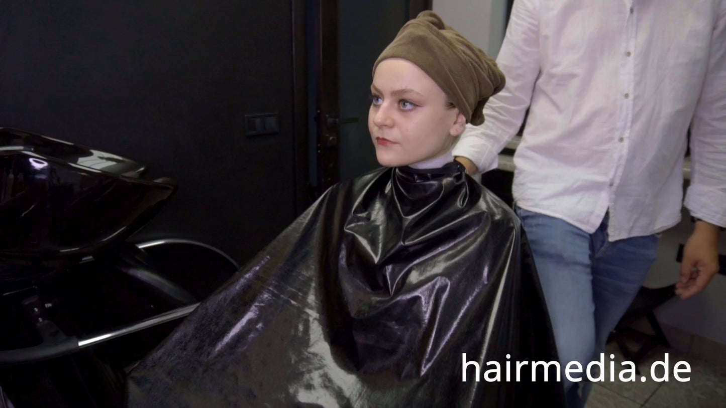 8169 Marianna teen shampoo and haircut in black laquer vinyl push button cape