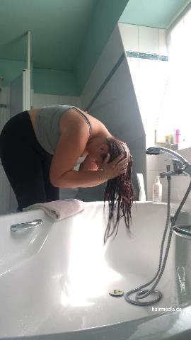 9000 AmeliaS curvy redhead self shampooing forward over tub at home