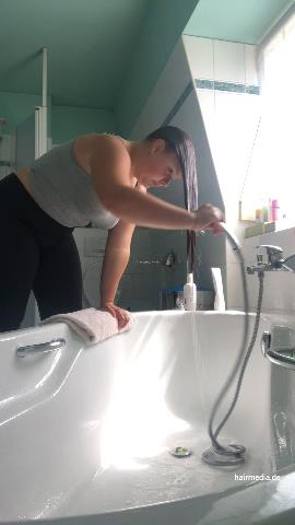9000 AmeliaS curvy redhead self shampooing forward over tub at home