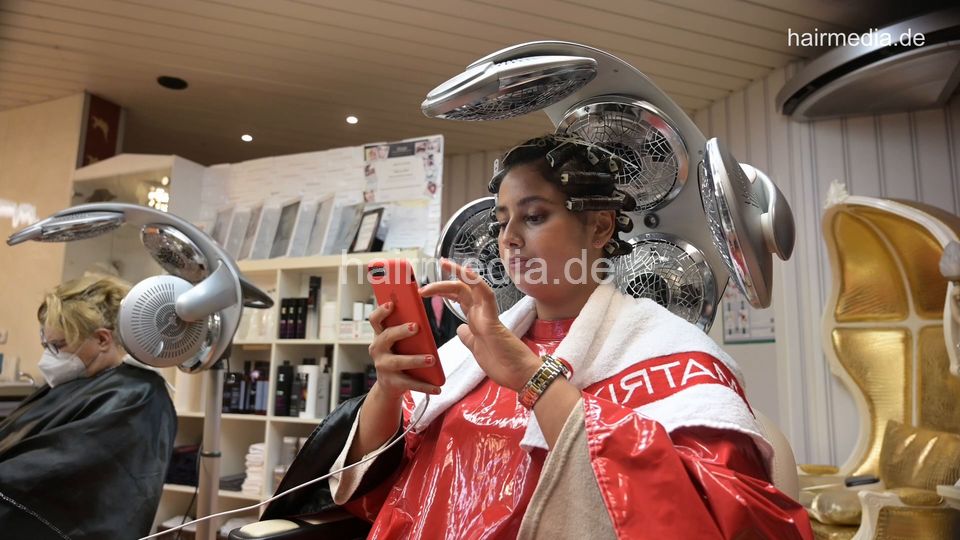 8158 Meriem 4 under the dryer in red pvc cape