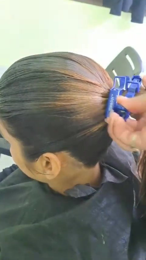 9149 Oiled hair combing.