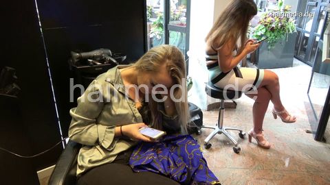 381 Sophie in black salon backward shampooing and haircut by barber
