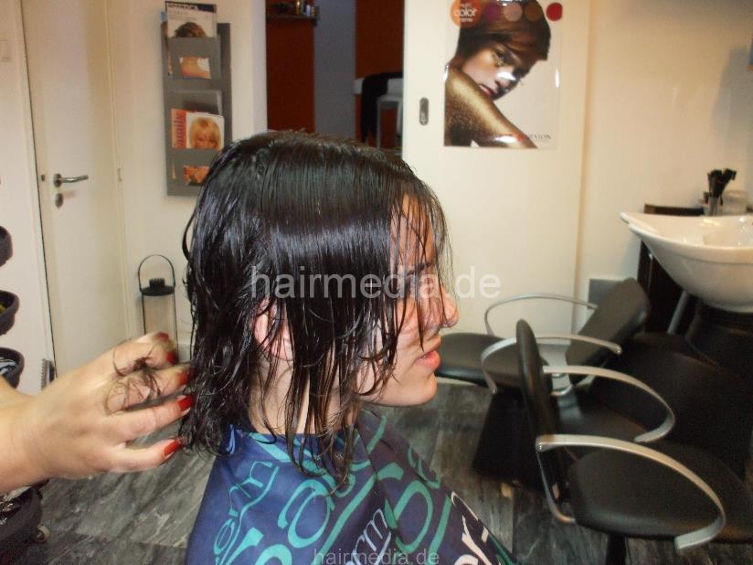 8053 Paula 2 haircut by mature barberette in white apron