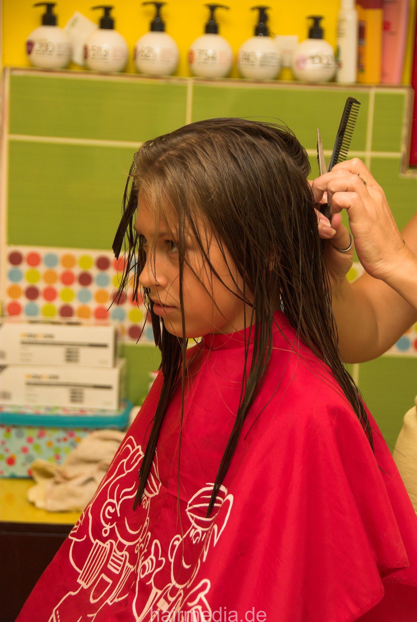 8083 Elena cut young girls hair cut in serbian salon in red cape