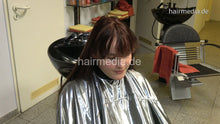 Cargar imagen en el visor de la galería, 388 06 Celestina teen by barber wash backward in heavy PVC cape