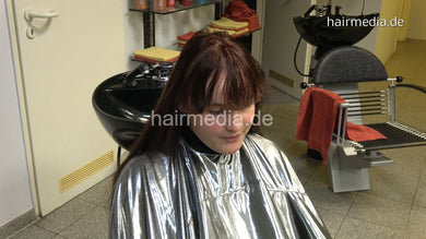 388 06 Celestina teen by barber wash backward in heavy PVC cape