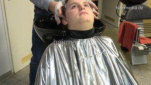 388 06 Celestina teen by barber wash backward in heavy PVC cape