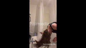1076 DeniseM curly hair self shampooing at home over bath tub and braiding