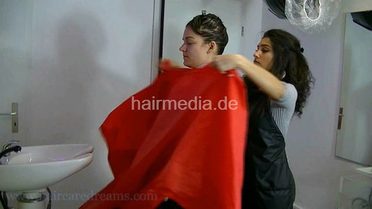 1305 VG shampoo forward at backward sink by Melody in apron, multicape