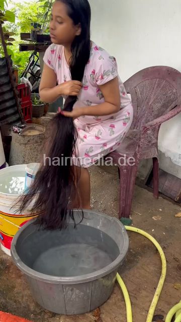 1242 250820 village hair washing of teen forward with help