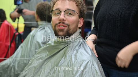 Josh by Jamilla student barberette in rollers, forward shampoo