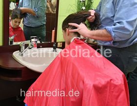 barberette student Maria first day forward shampoo curly hair by barber, student Maria watching