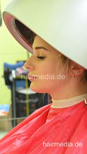 Carica l&#39;immagine nel visualizzatore di Gallery, 2303 VanessaH 3 chewing metal rollers wetset and hood dryer by barber in red cape - vertical video