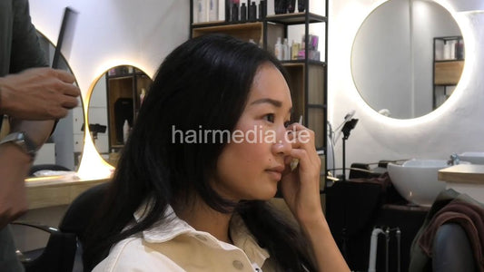 359 Karmen shampoo backward, haircare and blow out in black large cape