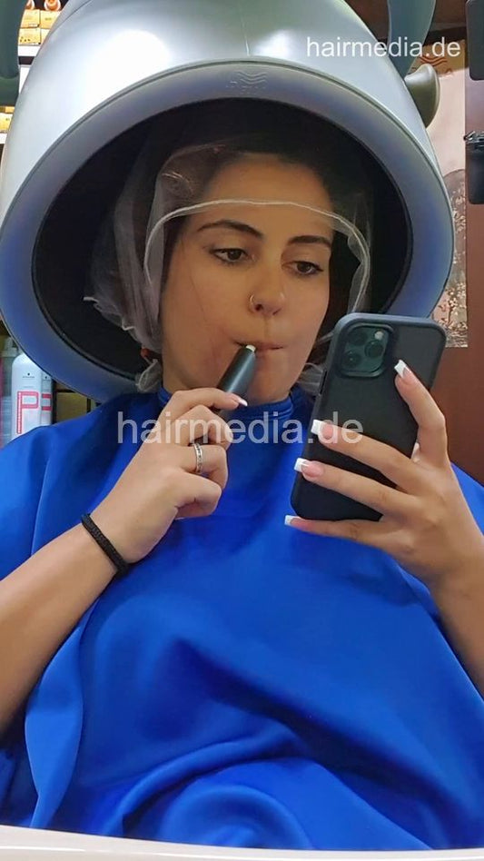 1227 LuisaB salonbarber session 4 smoking under the dryer - vertical video