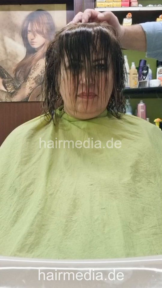 1252 Mahshids mom 2 haircut by barber - vertical video