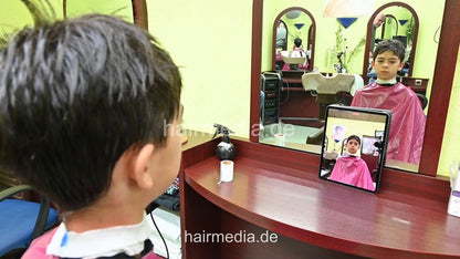 2308 Niklas 1 young boy pampering backward shampooing by barber, mom controlled