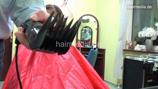 7117 Nora 2 buzz haircut by barber in pushbutton closure cape