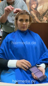 1246 Barberette Nora in apron curly hair forward shampooing by barber vertical video