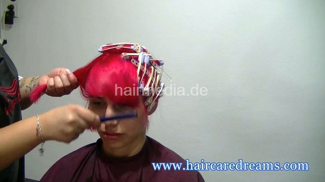Oliya red perm roller set by Melody in dyeing apron