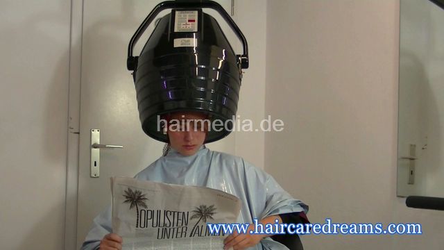Oliya red perm roller set by Melody in dyeing apron