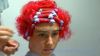Oliya red perm roller set by Melody in dyeing apron