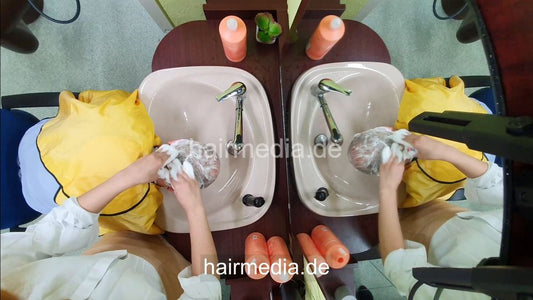 1251 Barberette Nora doing male client forward shampoo, scalp massage ceiling cam