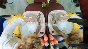 1251 Barberette Nora doing male client forward shampoo, scalp massage ceiling cam