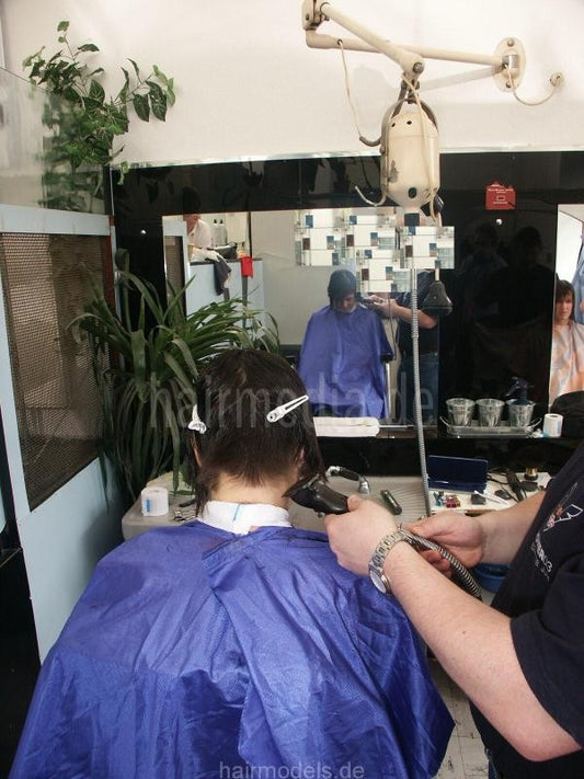 8028 Kerstin 1 cut and nape buzz punishment by barber truckdriver in barberchair