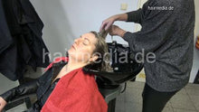 Load image into Gallery viewer, 1152 curvy TineZ in leathercoat vinylcape salon shampooing backward by leatherpants barberette