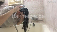 Laden Sie das Bild in den Galerie-Viewer, 1153 Natasha Ukraine self home hair shampooing over bathtub