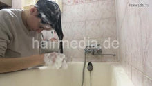 Laden Sie das Bild in den Galerie-Viewer, 1153 Natasha Ukraine self home hair shampooing over bathtub
