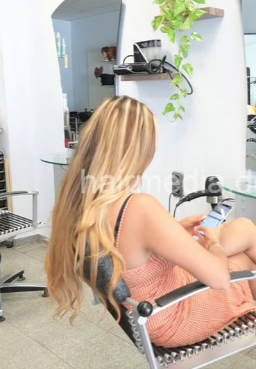 1209 1 Zoya waiting and typing in salon in summerdress vertical video