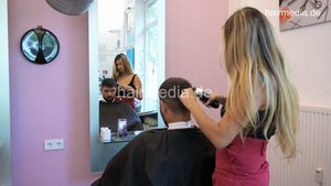 1209 Zoya serving male customer cousin 2 haircut in salon red skirt