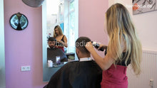 Cargar imagen en el visor de la galería, 1209 Zoya serving male customer cousin 2 haircut in salon red skirt vertical video