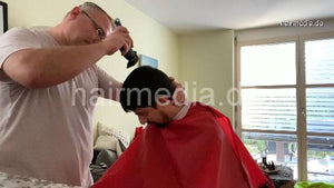 2012 20210111 StefanS home buzzcut by Nico in red cape clippercut