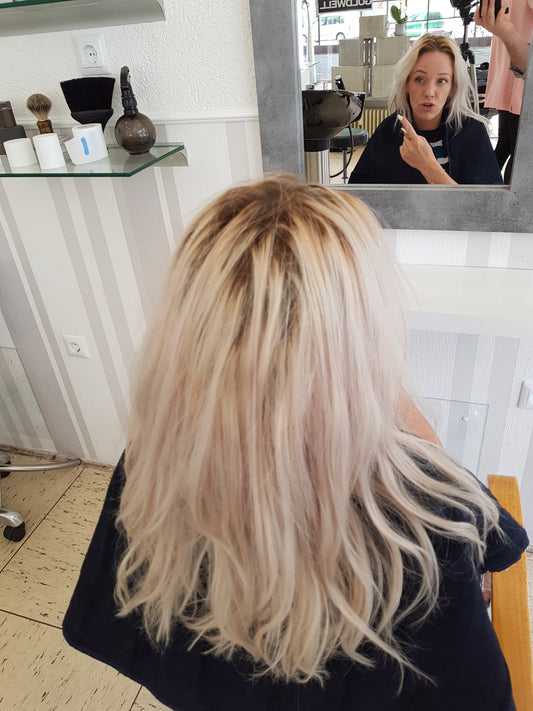 Salon owner shampooed backward by barber blonde long hair