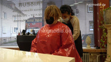 Laden Sie das Bild in den Galerie-Viewer, 4059 Cara 1 dry haircut in large red vinyl cape
