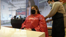 Load image into Gallery viewer, 4059 Cara 1 dry haircut in large red vinyl cape