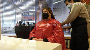 4059 Cara 1 dry haircut in large red vinyl cape