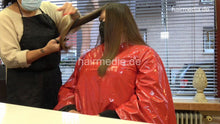 Load image into Gallery viewer, 4059 Cara 1 dry haircut in large red vinyl cape