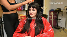 Load image into Gallery viewer, 1205 1 NatalieK pretty black dry haircut and shampoo afterwards by Zoya in large red PVC cape
