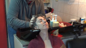 6207 Jana 1 backward salon shampooing hair and ear by barber
